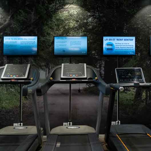 Tredemøller og skjermer i test- og kondisjonsavdelingen hos LFI Helse + Trening